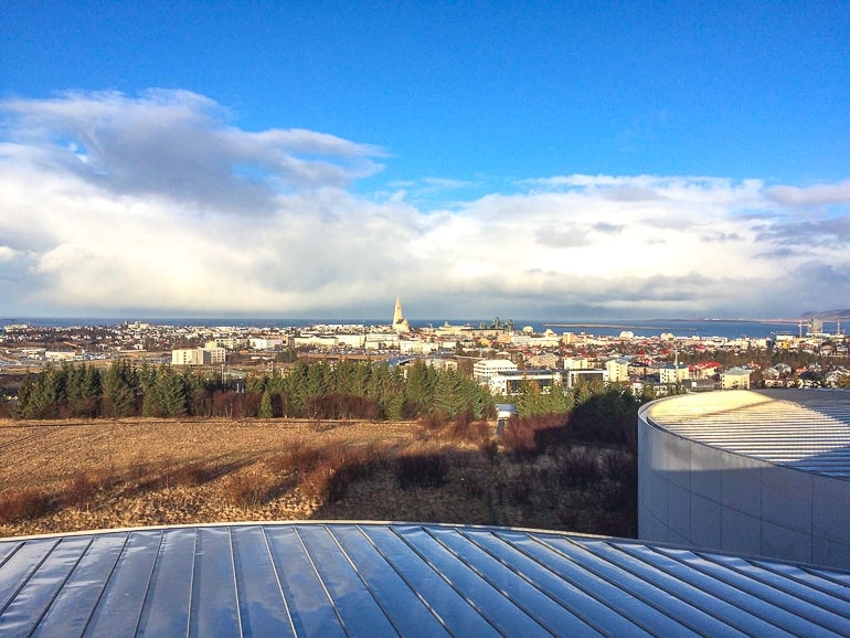 metal roof of observatory looking out over green landscape in reykjavik