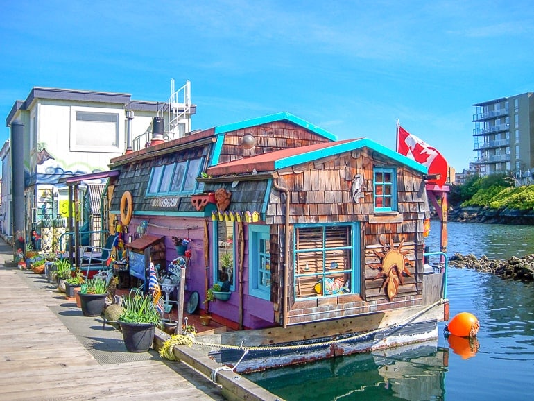colourful house boat in harbour in victoria bc canada