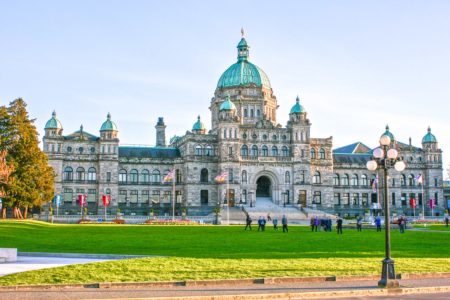 old parliament building with green dome and grass in front things to do in victoria bc