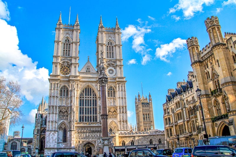 tall church towers in central london westminster abbey with blue sky behind