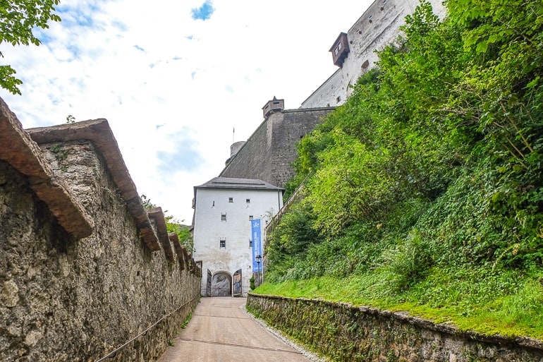 long steep pathway into castle entrance on a hill
