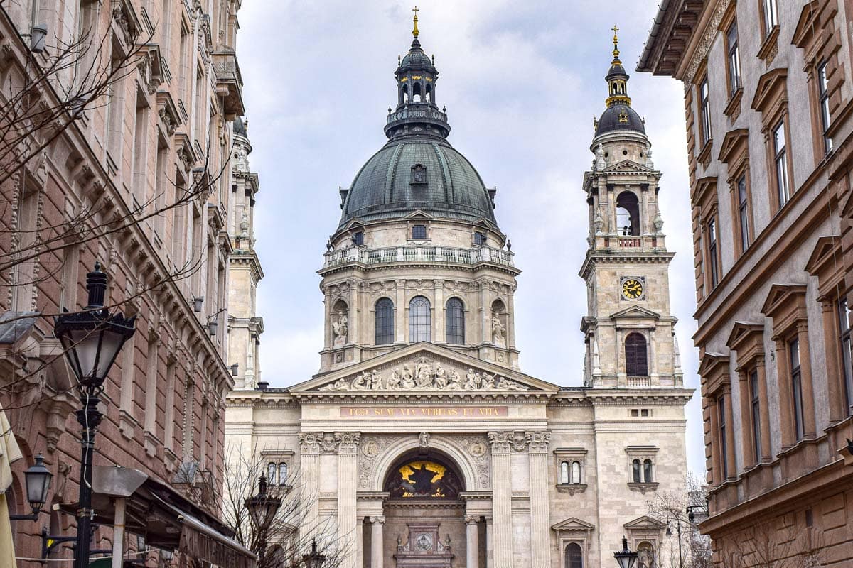 shot of cathedral domes standing at end of alleyway in central budapest.