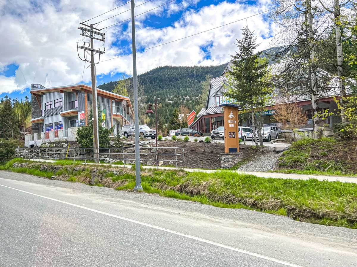 view from street of shops and accommodations in whistler.